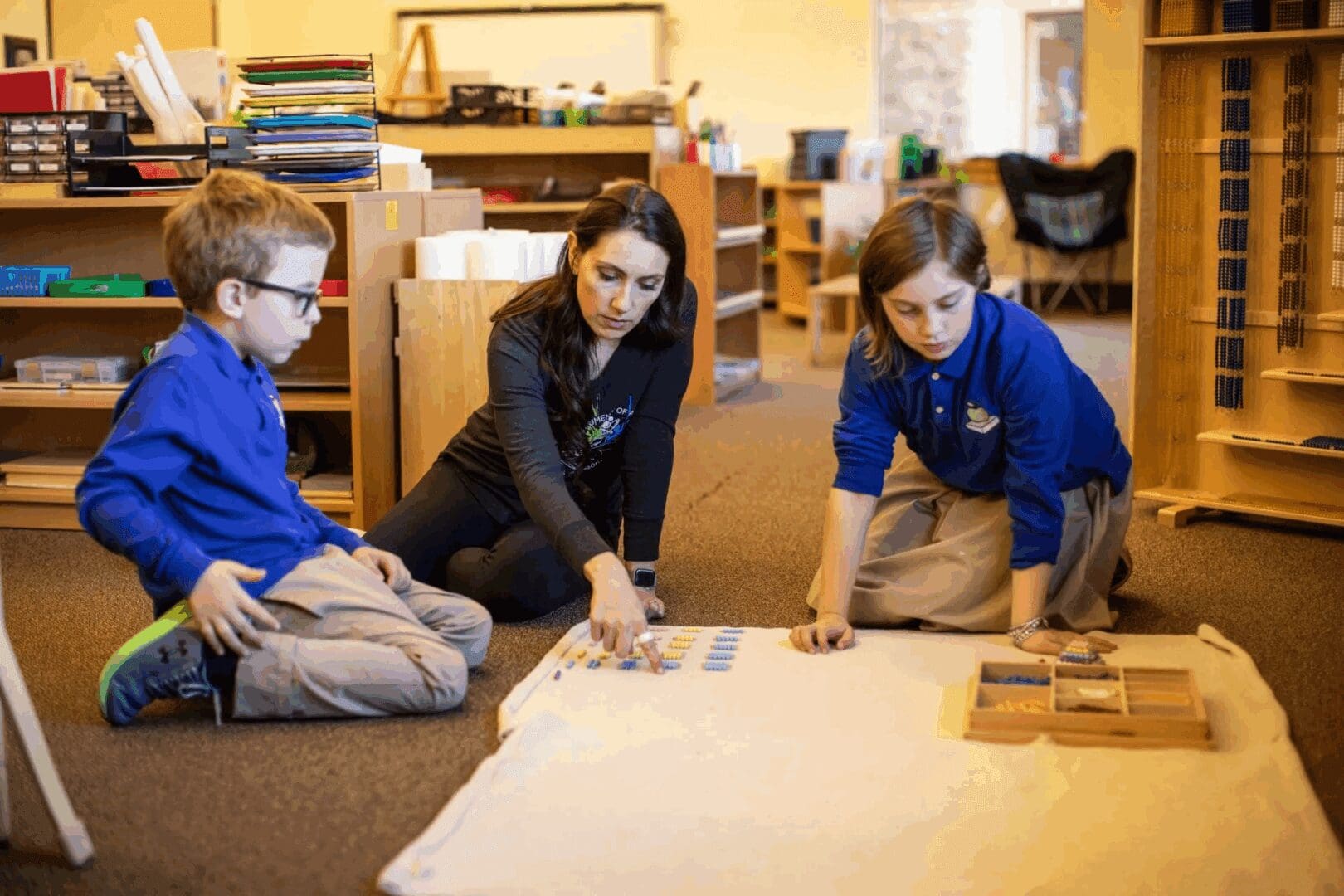 Teacher and students engaged in classroom activity.