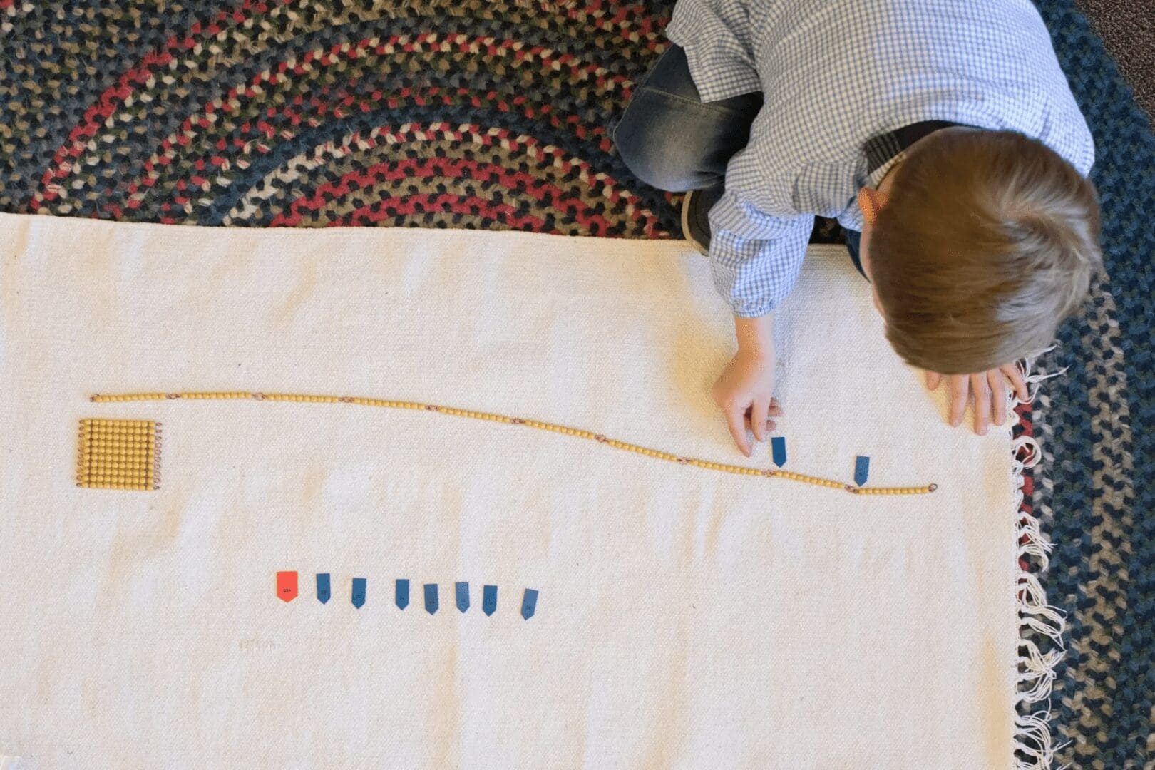 Child playing with educational counting tools.
